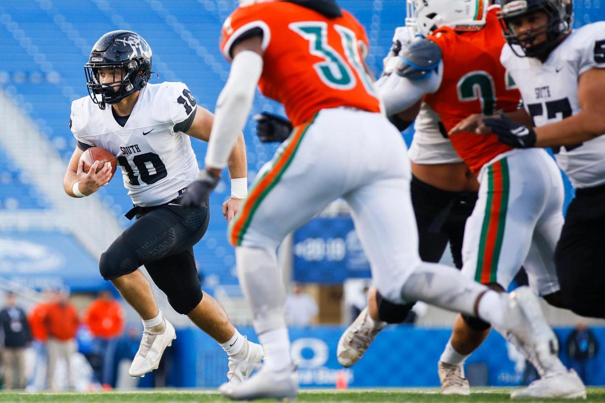 South Warren’s Luke Burton (10) looks for running room against Frederick Douglass at Kroger Field on Saturday. Burton rushed for 79 yards and two touchdowns.