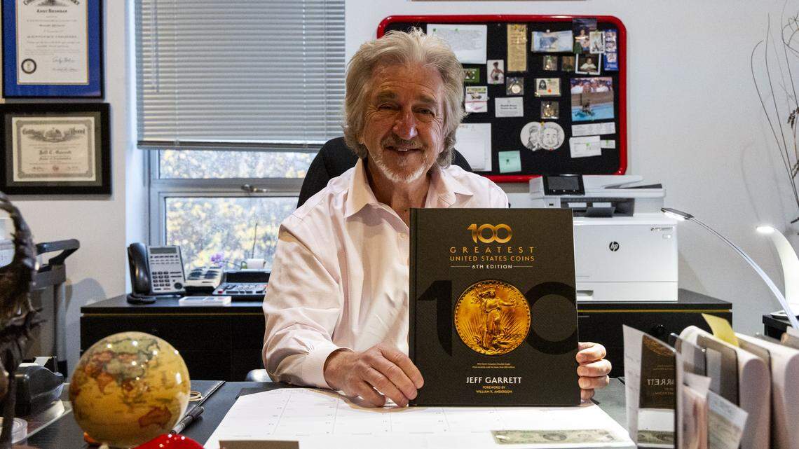 Jeff Garrett with a copy of his book, “100 Greatest U.S. Coins.” Garrett said as with most things, supply and demand dictate the market. But with coins, Garrett said there is a third factor in determining value: “Good stories really make the big difference. In the mega coin, the ones that are worth a lot of money, they have really good stories attached to them.”