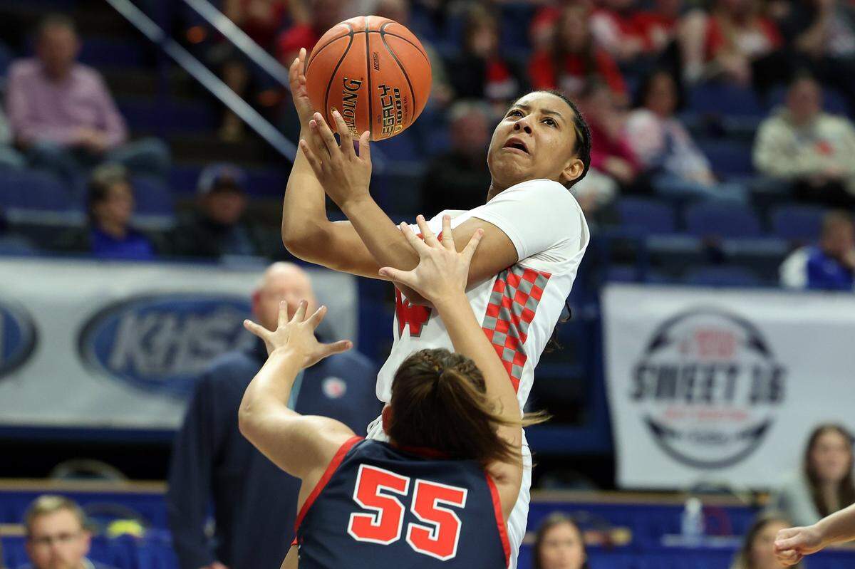 Butler’s Anieja Russell rises for a shot over Anderson County’s Faith Hyatt (55) on Wednesday night. Russell ended up with six points, five rebounds and five assists.