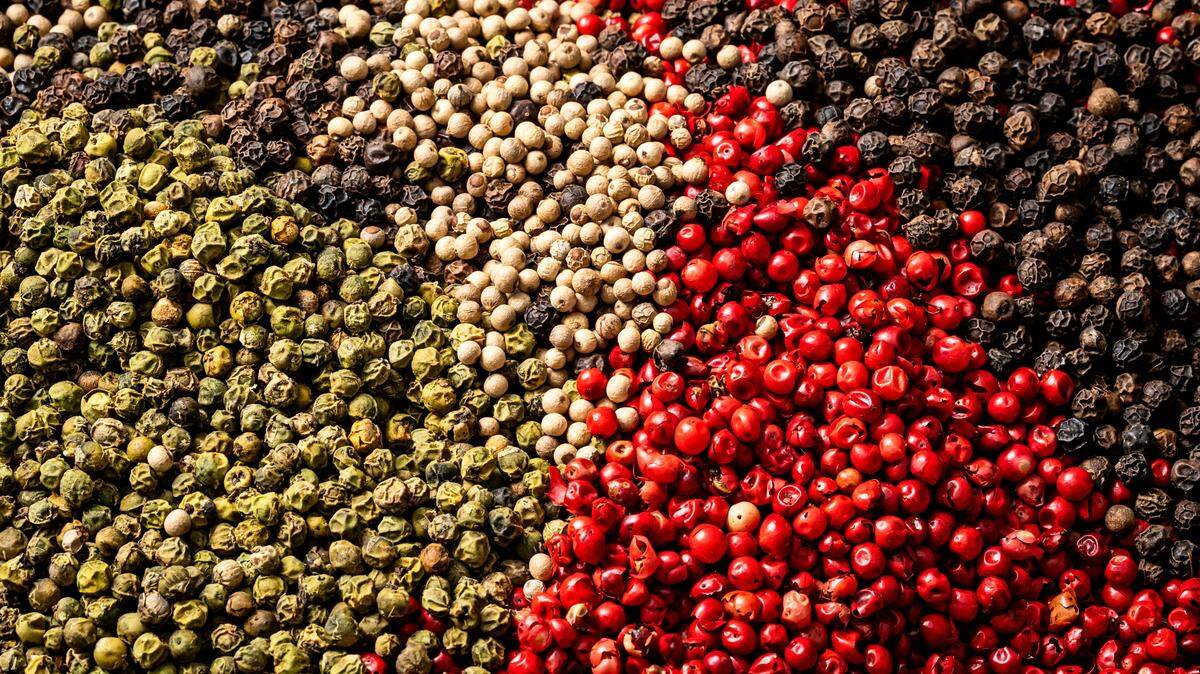 Black, white, pink, and green peppercorns.