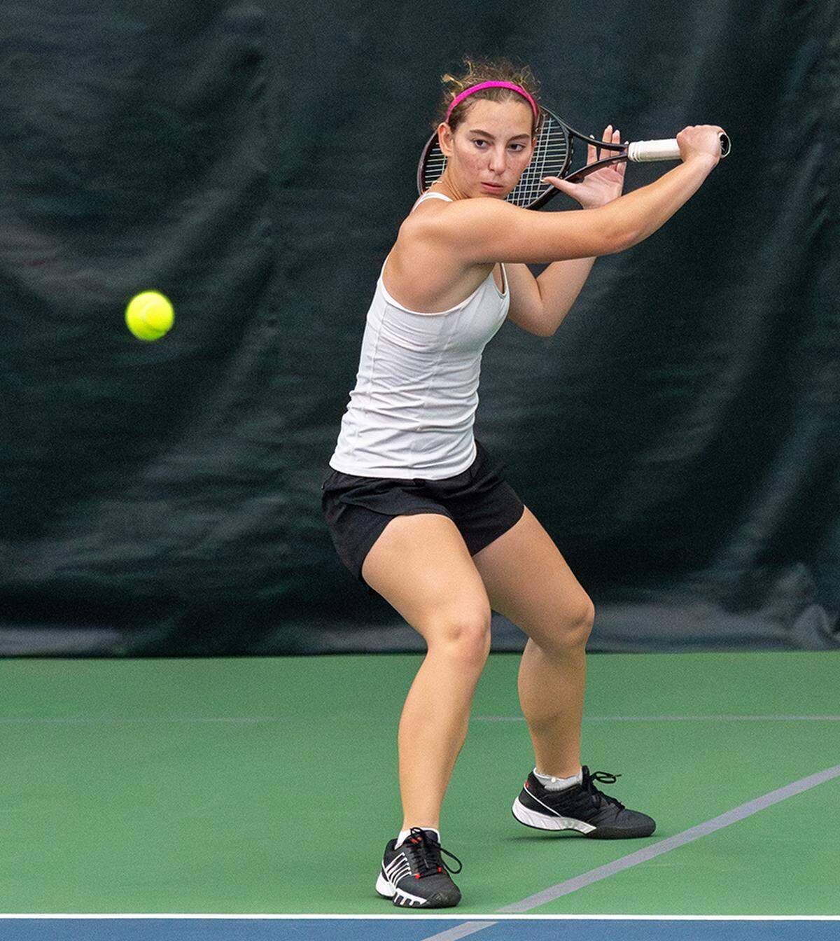 Scott County’s Sydney Zakic lines up a backhand during her singles win against Lexington Christian’s Katie Lankford in the 11th Region championships at the Bluegrass Racquet Club in Nicholasville on Friday.