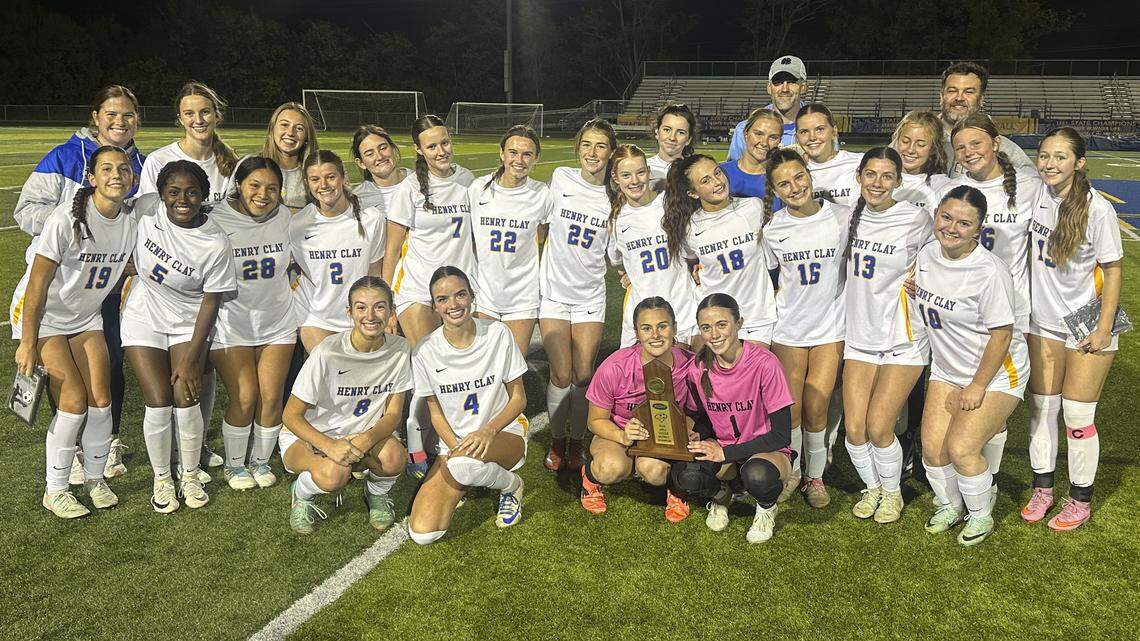 Henry Clay’s girls soccer team posed with the 42nd District Tournament championship trophy after its 3-2 win over Frederick Douglass at Henry Clay High School on Thursday.