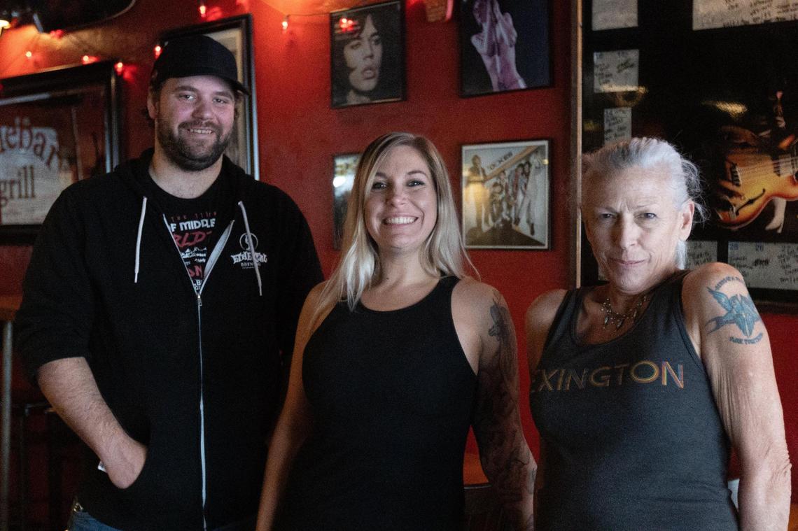 Former owner Lisa Cox, right, sold Sidebar Grill on North Limestone to new co-owners Devin Paulding, left, and Terry Keith, center.