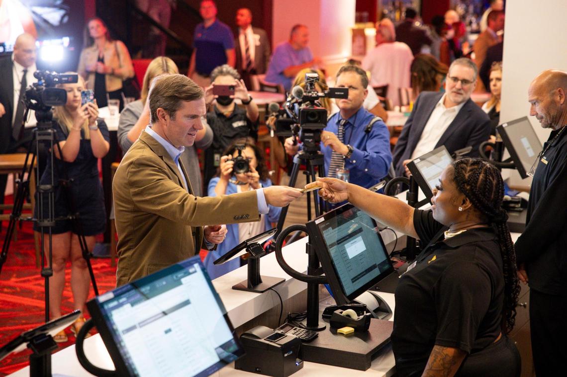 Gov. Andy Beshear places a bet after announcing the opening of a Caesars Sportsbook on the first day sports wagering was legal in the commonwealth on Thursday, Sept. 7, 2023, at Red Mile in Lexington, Ky.