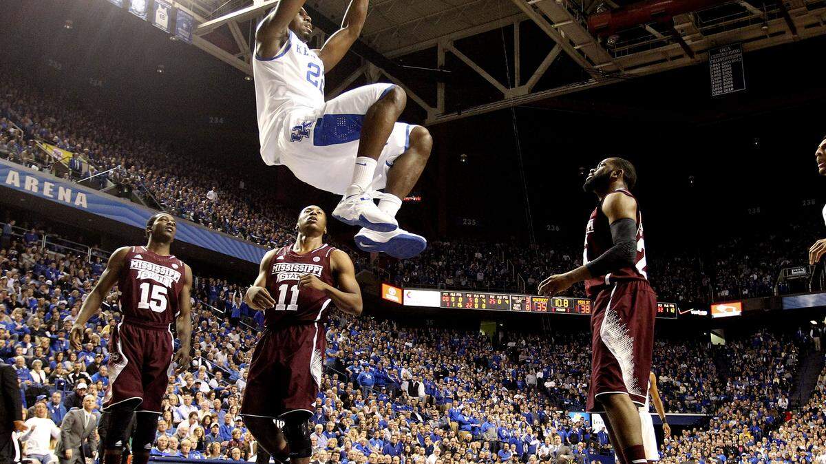 Kentucky Wildcats forward Alex Poythress (22) dunked over Mississippi State Bulldogs guard Jacoby Davis (11) as # 14 Kentucky played Mississippi State on Wednesday January 8, 2014 in Lexington ,Ky.  Photos by Mark Cornelison | Staff