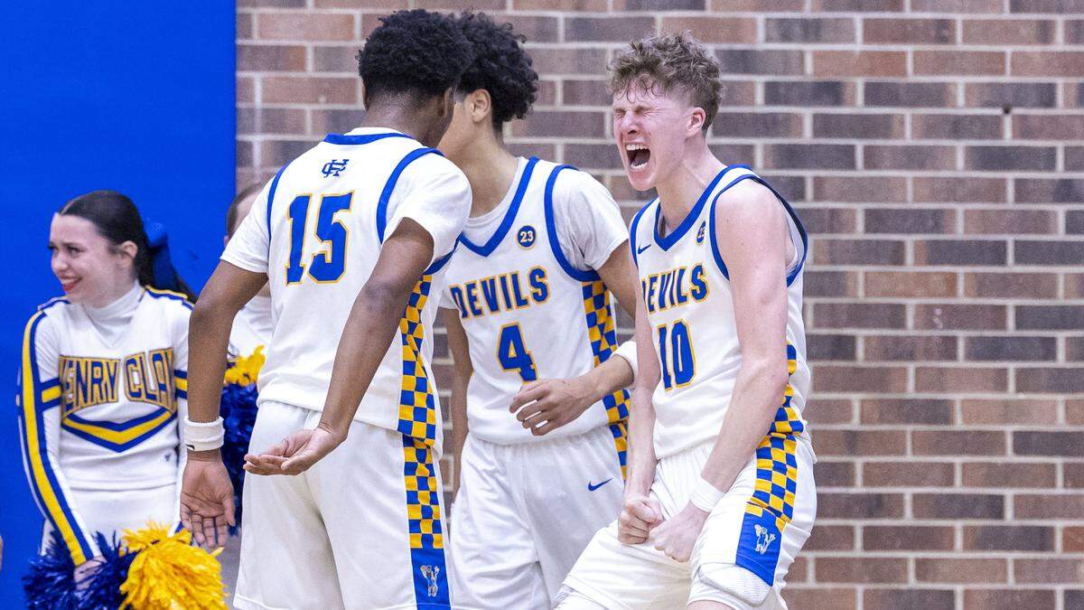 Henry Clay's Jack Hemenway (10), right, celebrates a potential three-point play during the Blue Devil's 70-67 overtime win over Bryan Station in a KHSAA basketball game, Friday, Feb. 13, 2026 at Henry Clay High School in Lexington, Ky.