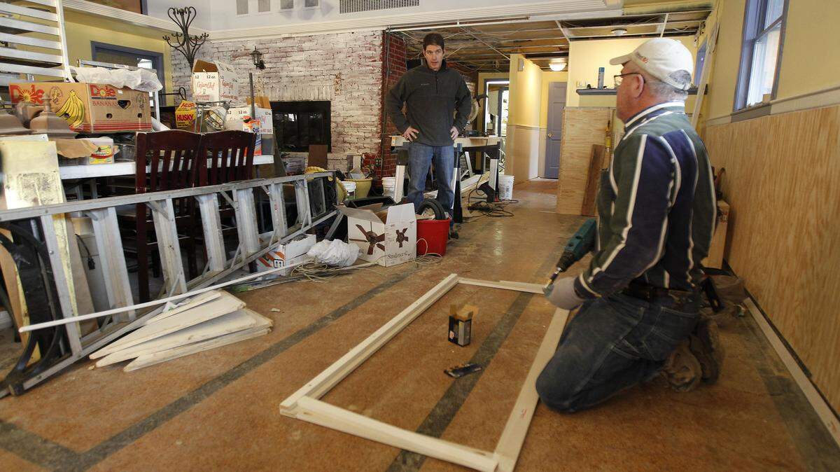 Cole Arimes, left talked to Terry Moore, right, in the dining room as Moore constructed frames for the new gazebo-type patio being built on the front at Coles at 735 Main, a new restaurant going in at the corner of East Main St. and Ashland Ave. in Lexington, Ky., Friday, January 20, 2012. Cole Arimes, who has been chef in Cincinnati for 18 years,  will be the executive chef/proprietor. Charles Bertram | Staff