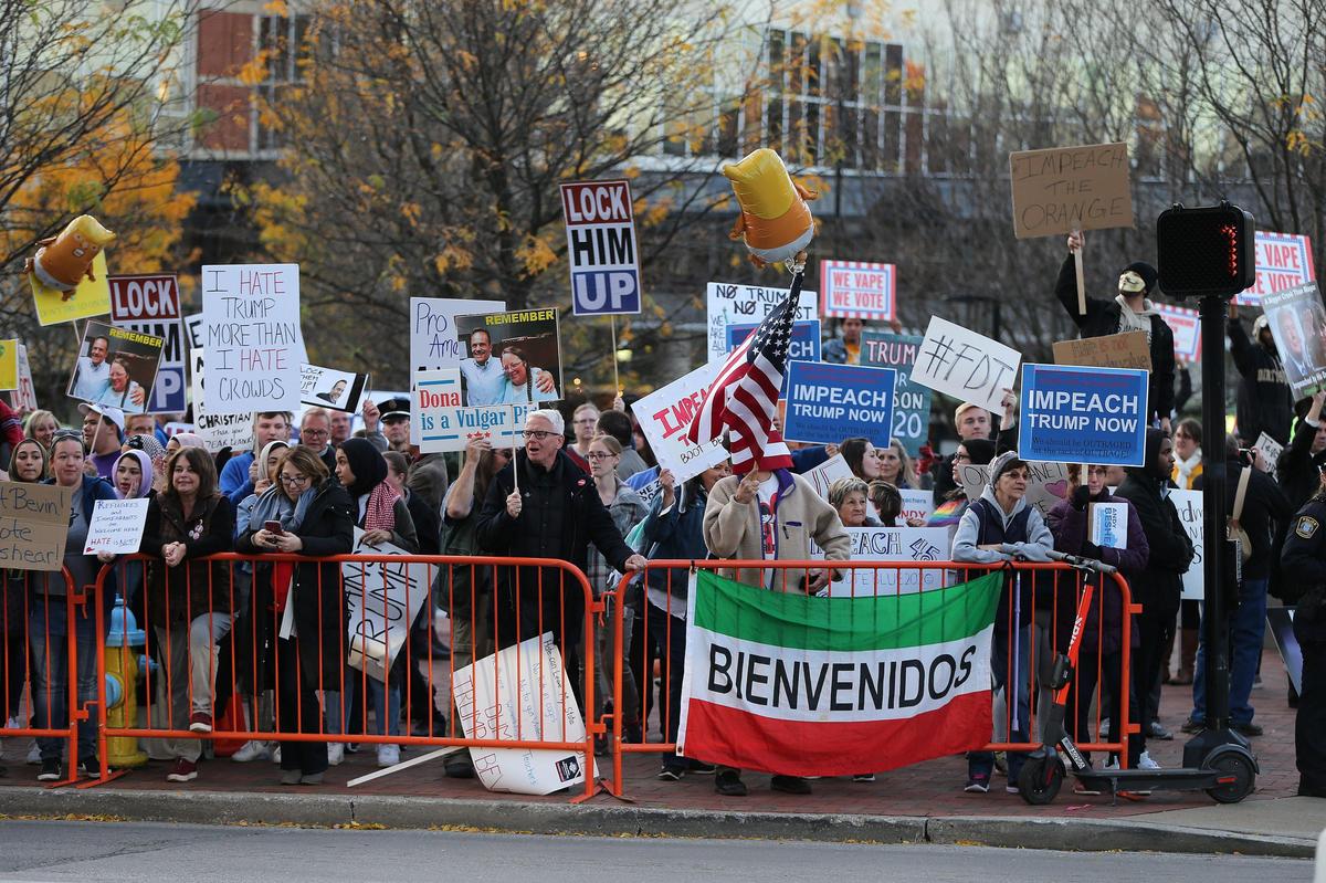 Demonstrators gathered to protest President Donald Trump at Triangle Park in Lexington, Ky., on Nov. 4, 2019.