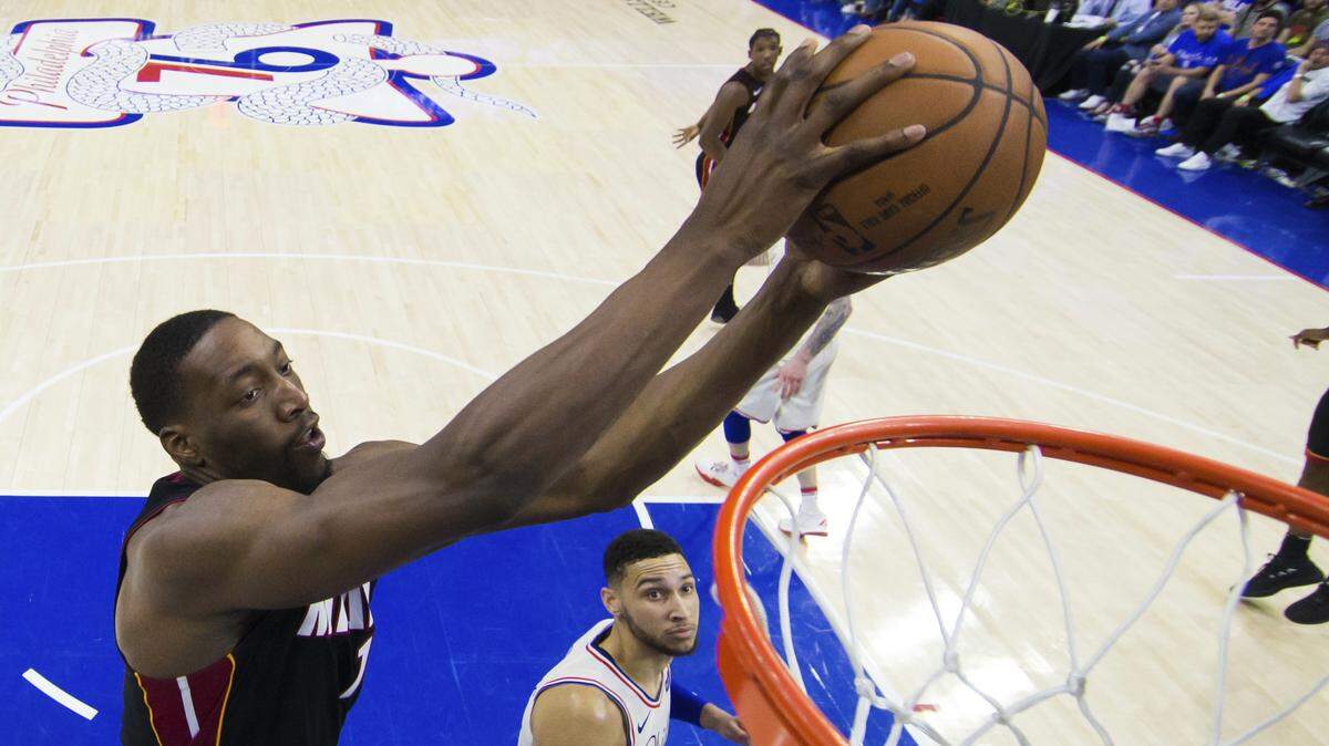 The Heat's Bam Adebayo, left, went to the basket against the 76ers' Ben Simmons during Game 1 of their first-round NBA playoff series game on April 14.