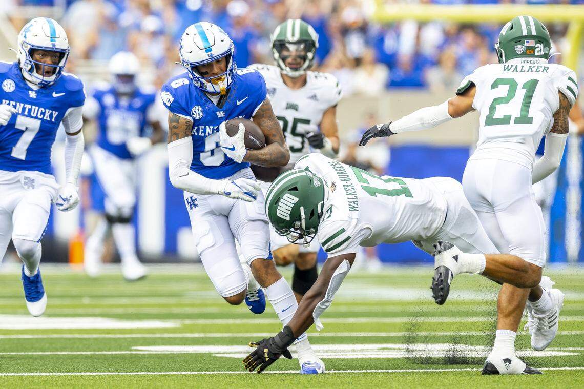 Kentucky wide receiver Dane Key (6) runs the ball as Ohio defensive end Marcel Walker-Burgess (17) tries to tackle him Saturday at Kroger Field.