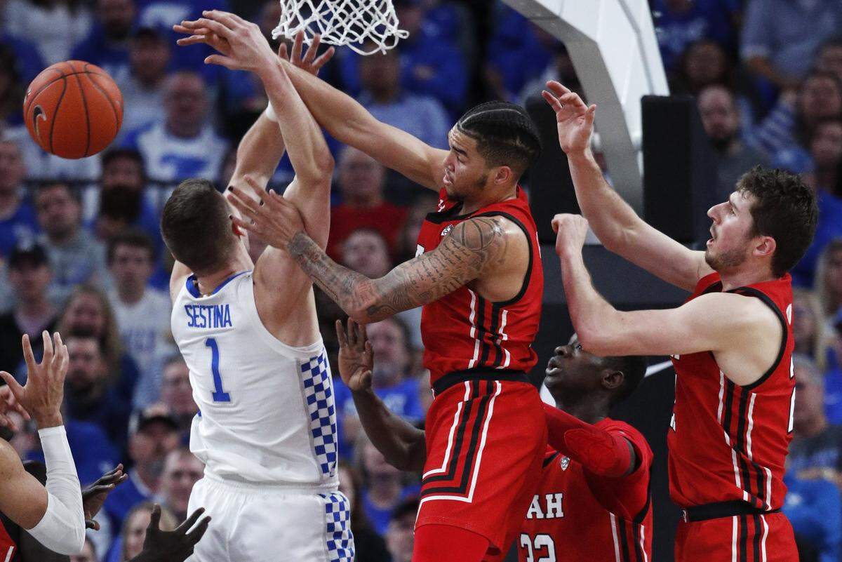 After missing three games due to a left wrist injury, Kentucky’s Nate Sestina, left, returned to action in UK’s 69-66 loss to Utah in Las Vegas Wednesday night.