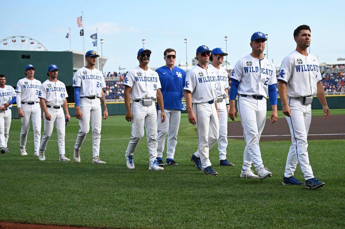 Jun 17, 2024; Omaha, NE, USA;  The Kentucky Wildcats head to the dugout before the game against the Texas A&M Aggies at Charles Schwab Field Omaha. Mandatory Credit: Steven Branscombe-USA TODAY Sports