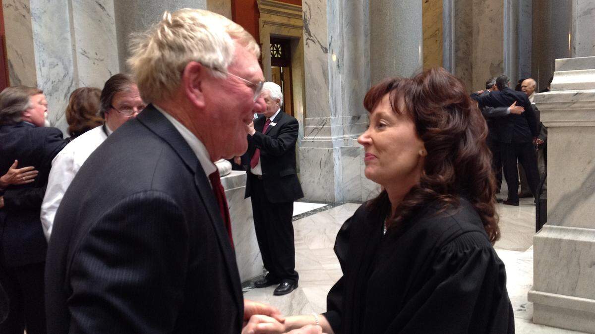 State Rep. Tom McKee, D-Cynthiana, congratulated new Supreme Court Justice Michelle M. Keller, right, on Tuesday.
