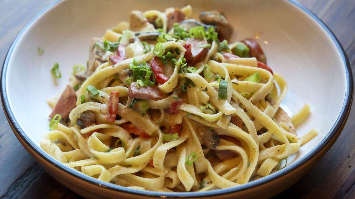 The Orleans pasta ($15.50) at Southern Cookhouse & Bar, photographed Sunday, Sept. 7, in Lexington, Ky., is made with Fettuccine Alfredo, Cajun chicken, andouille sausage, mushrooms, roasted red peppers and green onions.