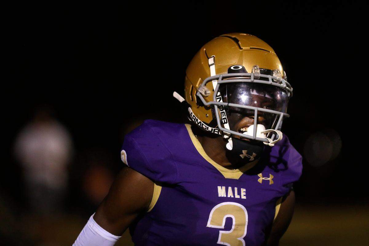 Male's Antonio Harris celebrates scoring a touchdown against Indianapolis Roncalli Friday night.Sept. 29, 2023