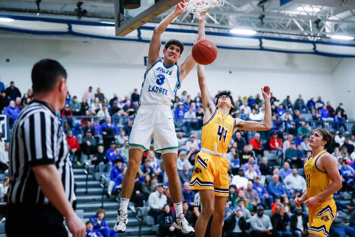 North Laurel’s Reed Sheppard (3) dunks the ball past Lyon County’s Lukas Breedlove (44) during a game at Lexington Catholic on Jan. 7, 2023.