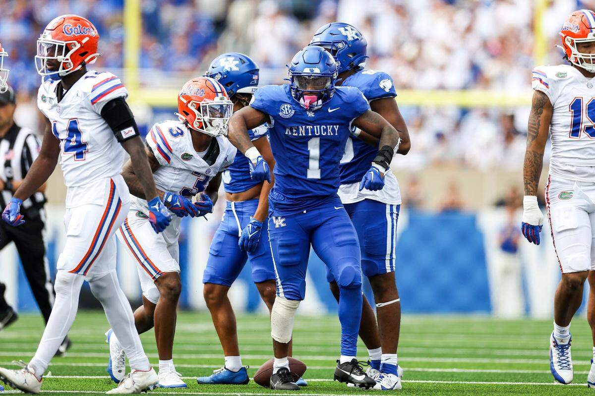 Kentucky running back Ray Davis (1) celebrates a run for a first down against Florida during Saturday’s game at Kroger Field.
