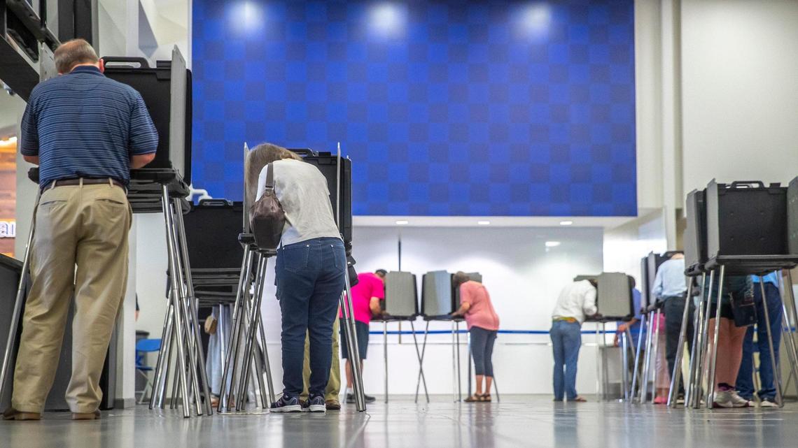 Voters cast their ballots during early voting at Kroger Field in Lexington, Ky., on Thursday, May 12, 2022.