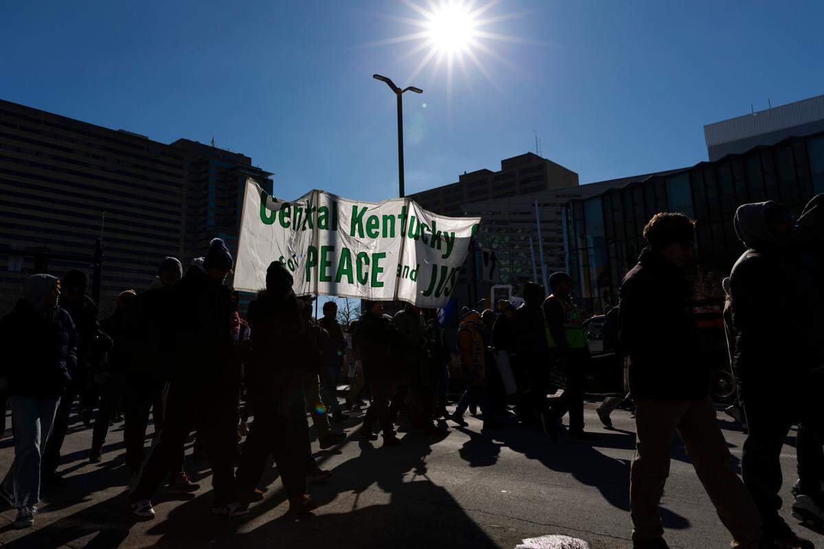Members of the Lexington community walk in the Martin Luther King Jr. Freedom March in Lexington, Ky., on Monday, Jan. 20, 2025.
