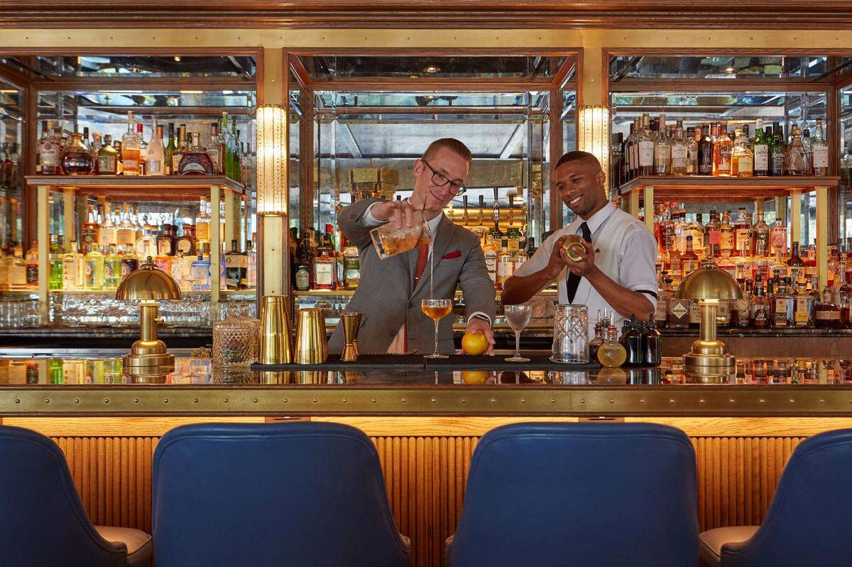 Bartenders Dominik Lenikowski (left) and Andre Bastine prepare for a mixology class in the Pembroke Bar at the Dupont Circle Hotel.