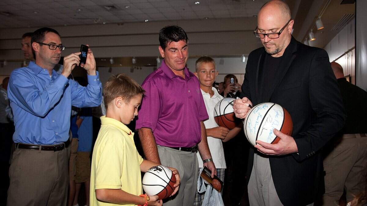 Kentucky hoops legend Rex Chapman, part of the inaugural class of the Kentucky High School Basketball Hall of Fame, signs a ball for a fan in Elizabethtown on July 14, 2012. hall of fame’s museum is leaving Elizabethtown, its home since 2018.