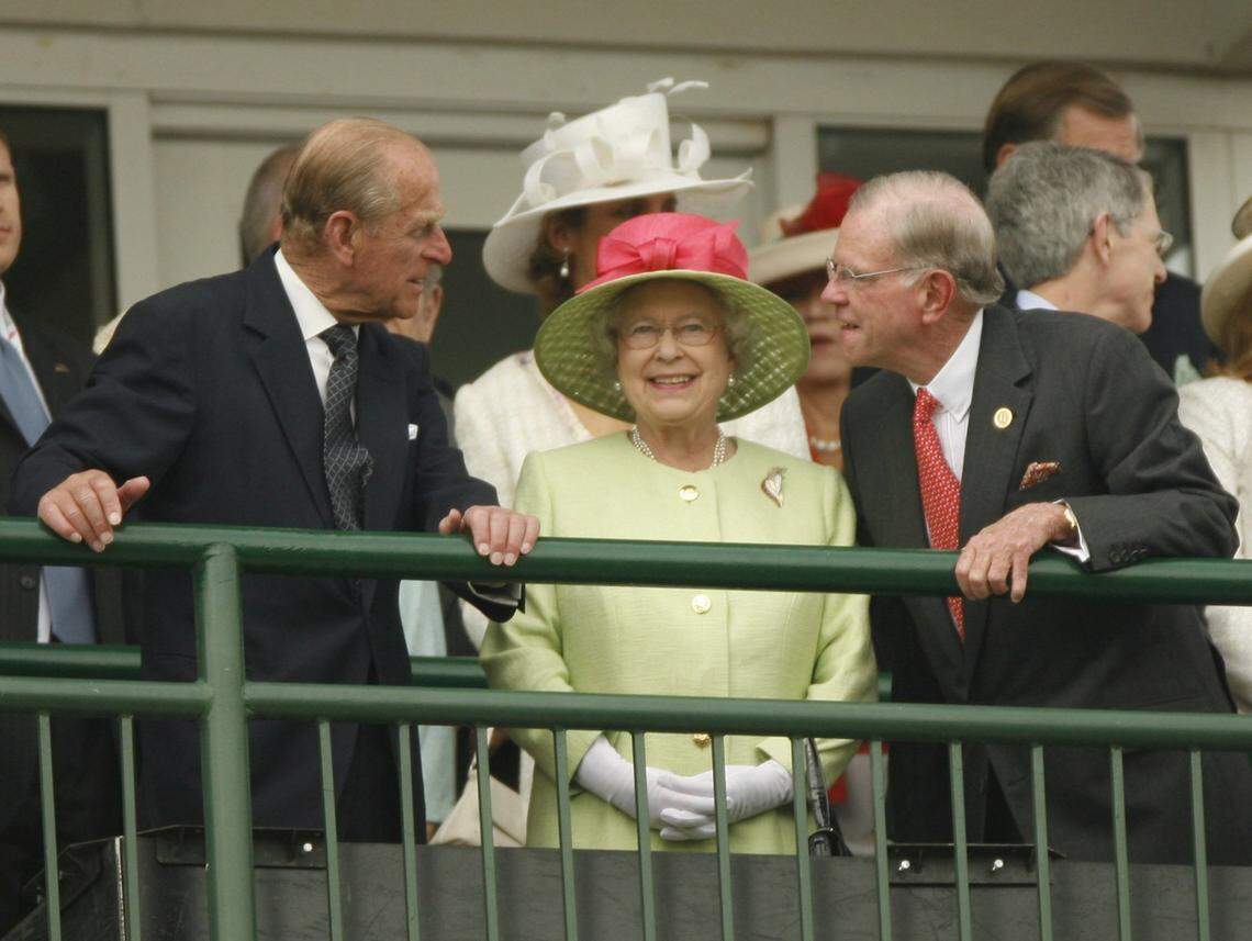 Queen Elizabeth II, between Prince Phillip on the left and Will Farish, right, watches from the balcony of the Grand Stand at the 133 Running of the Kentucky Derby at Churchill Downs, Louisville, Ky Saturday May 5, 2007. Photo by Ken Weaver