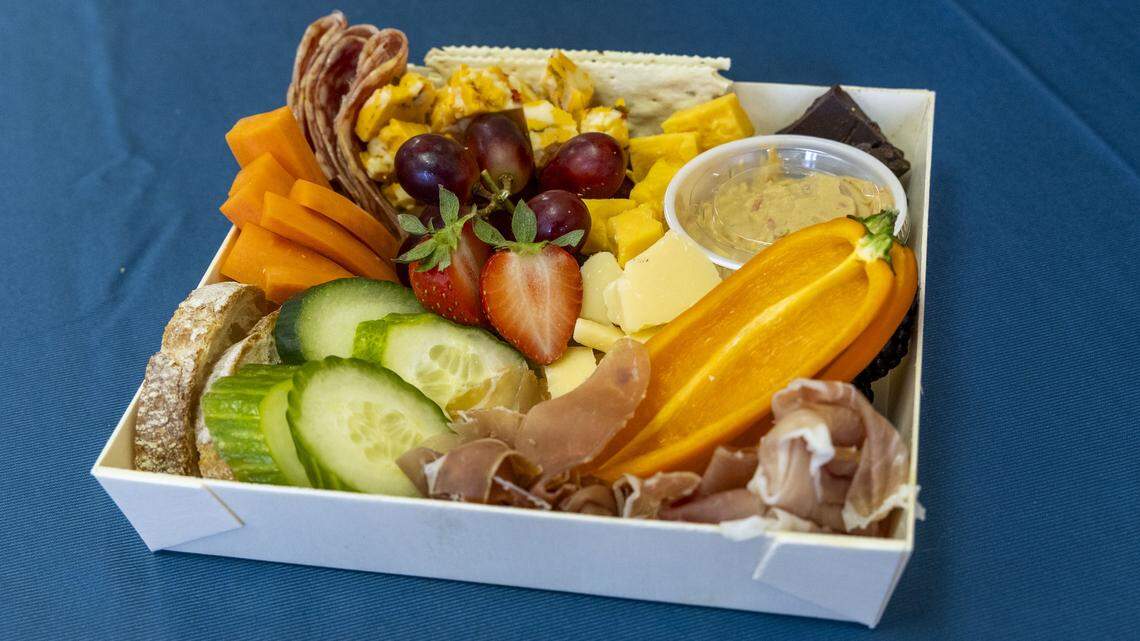 A Gone Grazey charcuterie board (Grab & Graze size; $12) from Graze Craze, the store's signature platter that features a variety of meats, cheeses, fruits and vegetables with a touch of dessert. Boards come in seven different sizes, and each comes with the choice of 10 homemade dips. Photographed Wednesday, Dec. 10, 2025, in Lexington, Ky.