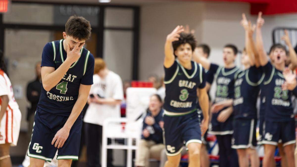 Great Crossing’s Graham Swartz struck a pose as teammates behind him celebrated one of his fourth quarter 3-pointers during the Warhawks’ 69-51 win at Coach Billy Hicks Gymnasium on Saturday in Georgetown.