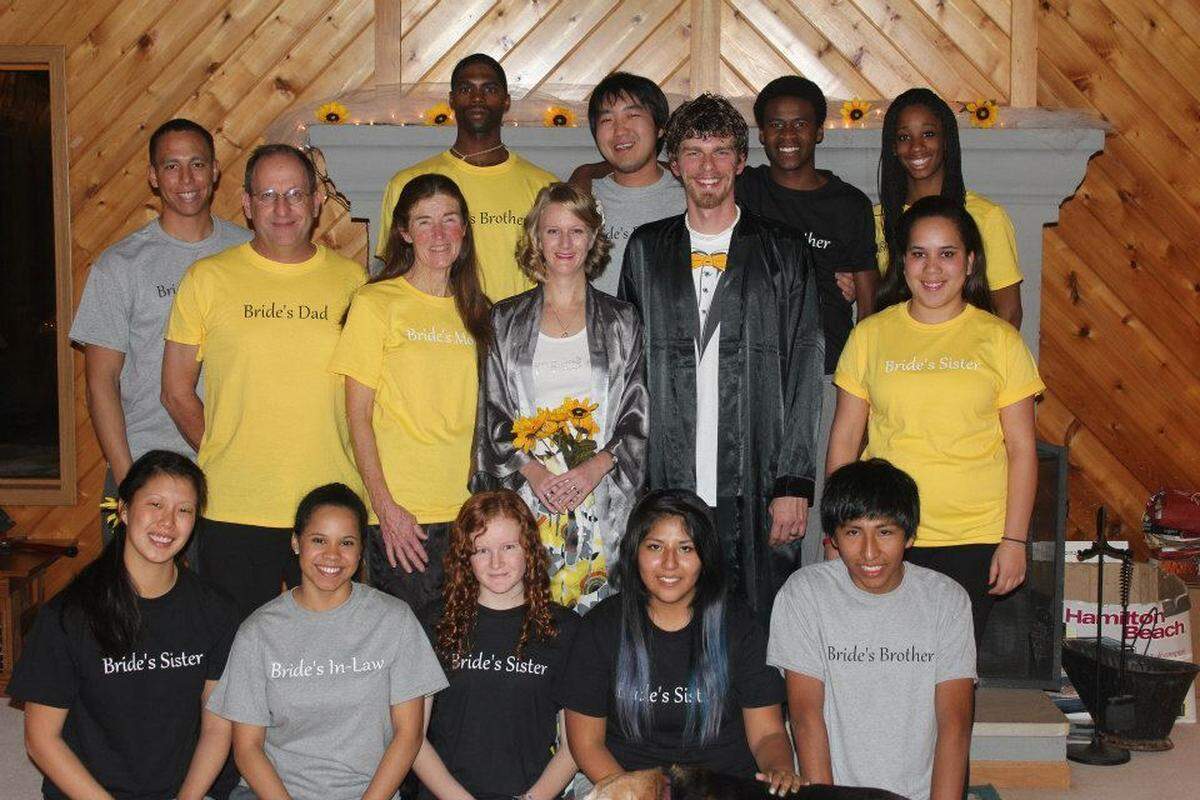 The family of former Kentucky Wildcats track star Kendra Harrison as it appeared in 2012. Front row, from left: Bo, Eimy (daughter-in-law), Kara, Gabi and Victor. Middle row: Parents Gary and Karon; Casey, Mike (son-in-law) and Tasha. Back row: JoJo, Cory, Hyung, Kipp and Kendra. (Photo submitted).