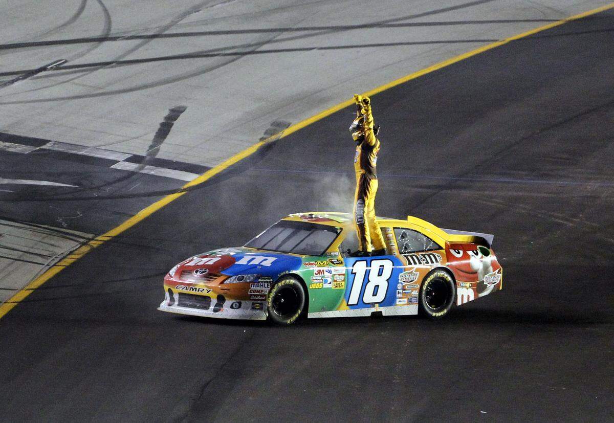 Kyle Busch celebrated after winning the inaugural NASCAR Cup Series Quaker State 400 at Kentucky Speedway in 2011.