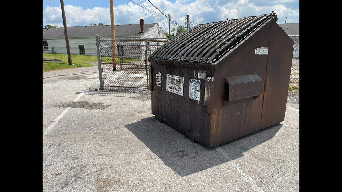 The victim of a triple shooting in Elizabethtown, Ky. was shot by the dumpster in the back lot of the parking lot of the Hardin County Justice Center.