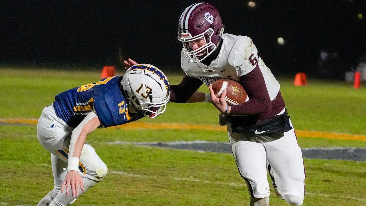 Sayre’s Jackson Stuart (13) moves in for a tackle against Pikeville’s Isaac Duty (6) on Friday night.