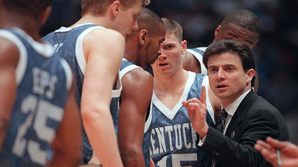 UK Coach Rick Pitino talks with his team during a time out late in the game