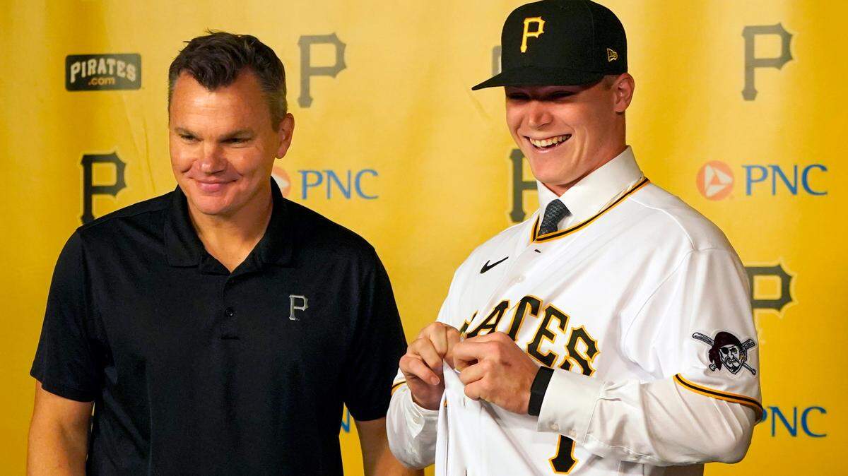 Henry Davis, right, the No. 1 overall pick by the Pittsburgh Pirates in the Major League Baseball draft, interacted with General Manager Ben Cherington at PNC Park before a game against the New York Mets on Sunday. The Pirates signed the 21-year-old catcher on Sunday.