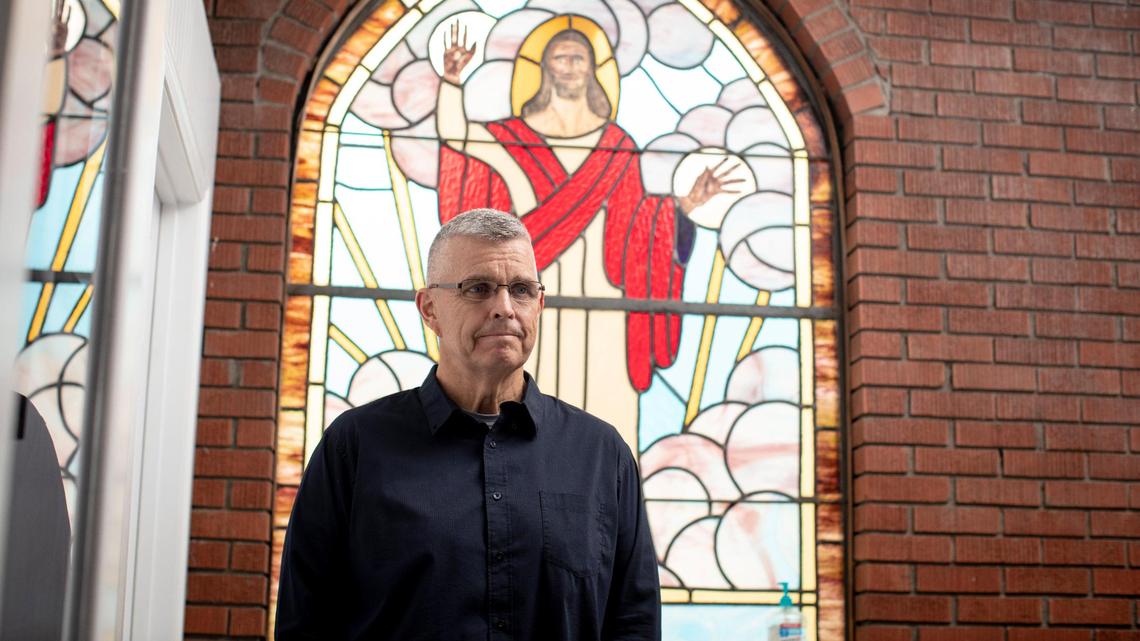 Pastor Buddy Simpson poses for a portrait at the Wallins Church of God in Harlan County, Ky., Friday, April 9, 2021. Simpson got the COVID-19 vaccine and the church has been meeting in their parking lot until recently.
