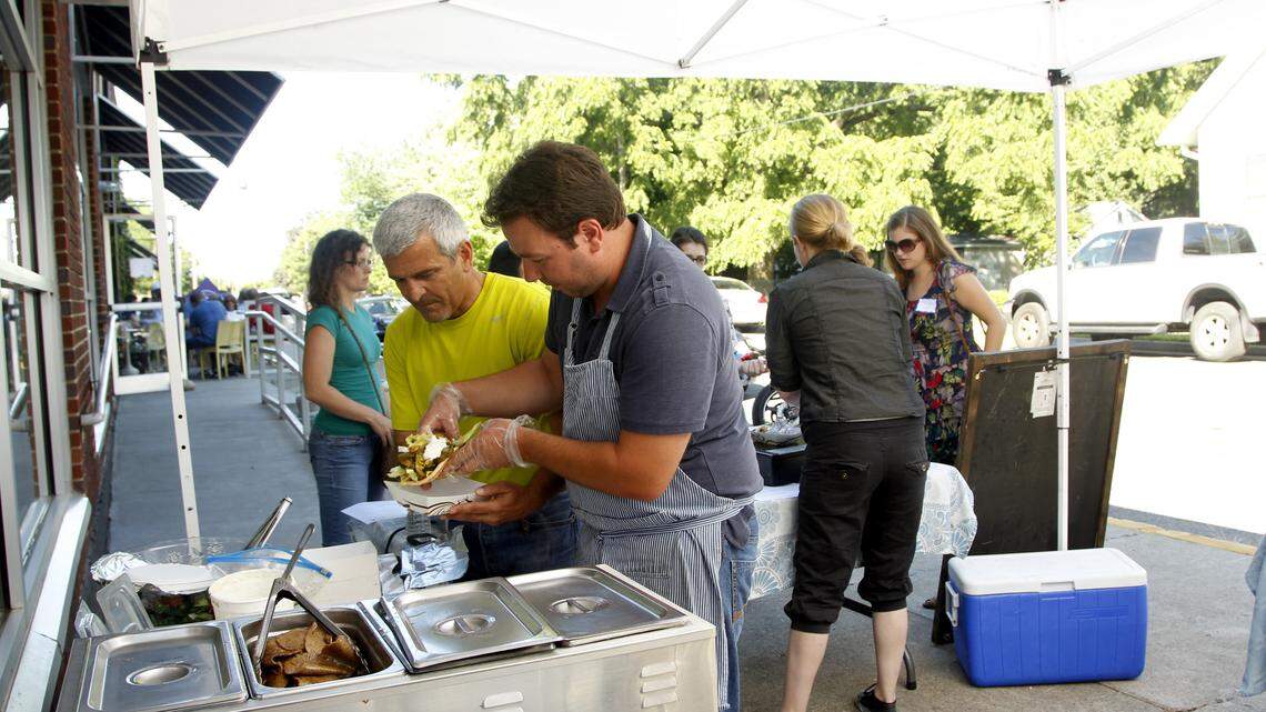 Ilias Pappas, right, and Cary Tsamas served a gyro from Athenian Grill outside West Sixth Brewery in Lexington  in 2013. Pappas hopes to serve box lunches at the Henry Clay Estate.