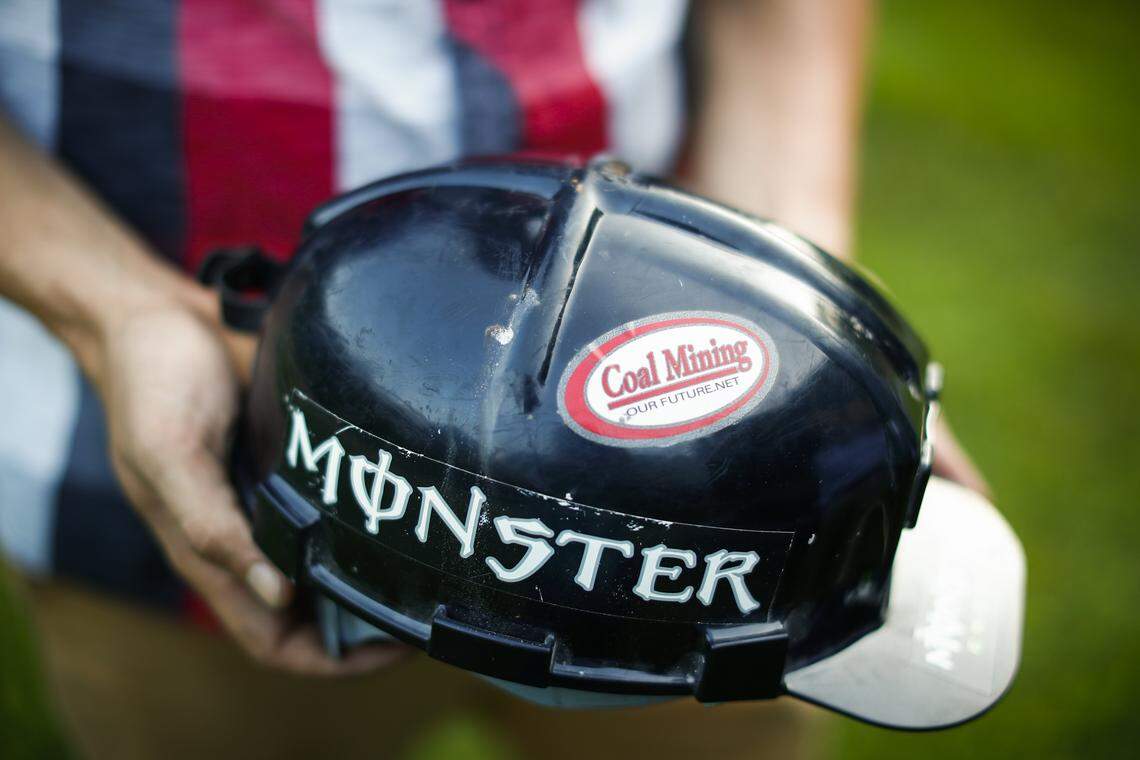 Scotty Cox, of Evarts, Ky., shows his coal miner’s helmet at his home, Thursday, July 25, 2019. Cox was among about 1,100 coal miners in Kentucky, West Virginia and Virginia who lost their jobs when coal company Blackjewel filed bankruptcy in early this month.