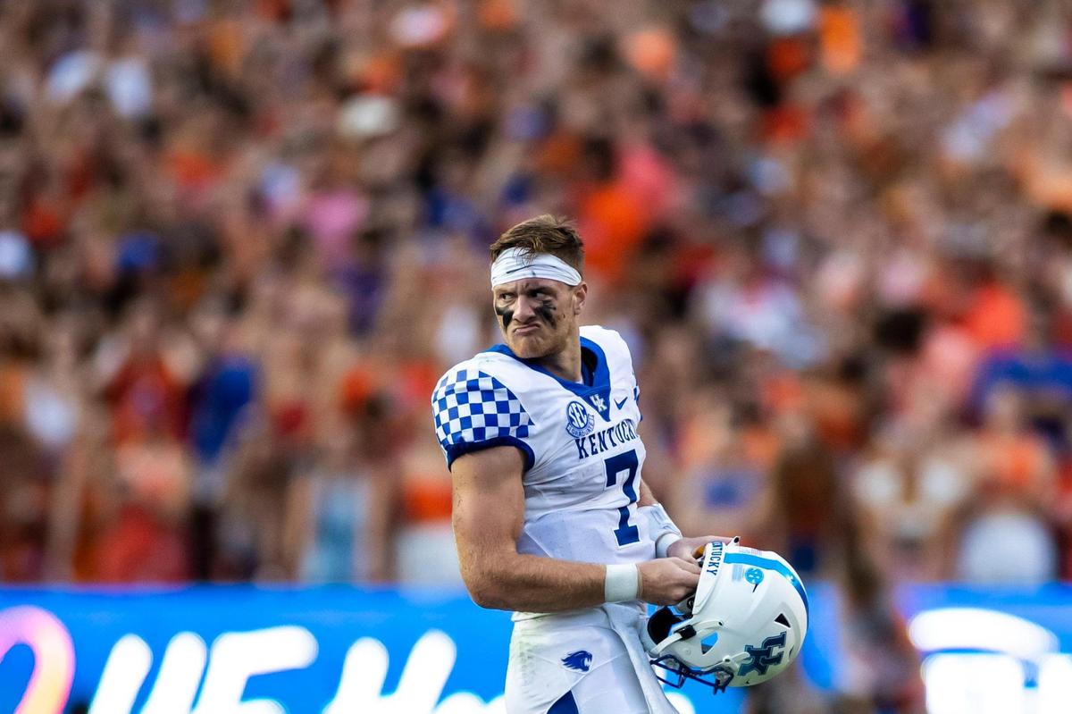 Kentucky Wildcats quarterback Will Levis grimaces after being sacked and losing his helmet from the hit by the Florida Gators defense during the game at Ben Hill Griffin Stadium in Gainesville, Fla., Saturday, September 10, 2022. UK would go on to beat the Gators, 26-16, making head coach Mark Stoops the program’s all-time winningest coach.