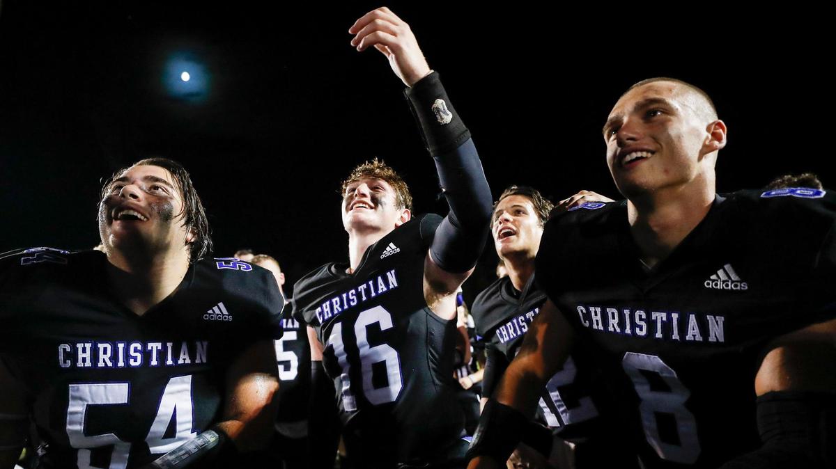 Lexington Christian’s Grant Vaught (54), Mason Moore (16) and Tyler Morris (8) celebrated on the field after a game against Lexington Catholic at Lexington Christian Academy in Lexington, Ky., Friday, Sept. 17, 2021. LCA defeated Lexington Catholic 43-7.