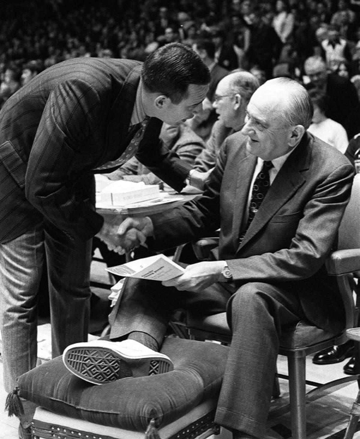 Kentucky basketball coach Adolph Rupp is greeted by Alabama coach and former Wildcats player C.M. Newton before their game in Memorial Coliseum on Feb. 22, 1971. Rupp, then 69, was sidelined for the game with a foot infection complicated by diabetes. He had been hospitalized at UK since Feb. 8, but commuted to home games and some practices. Rupp missed three games, viewed three others as a spectator and even made a road trip to Vanderbilt. Assistant coach Joe B. Hall was named active coach during Rupp’s absence. Newton was a member of UK’s 1951 national championship team under Rupp.