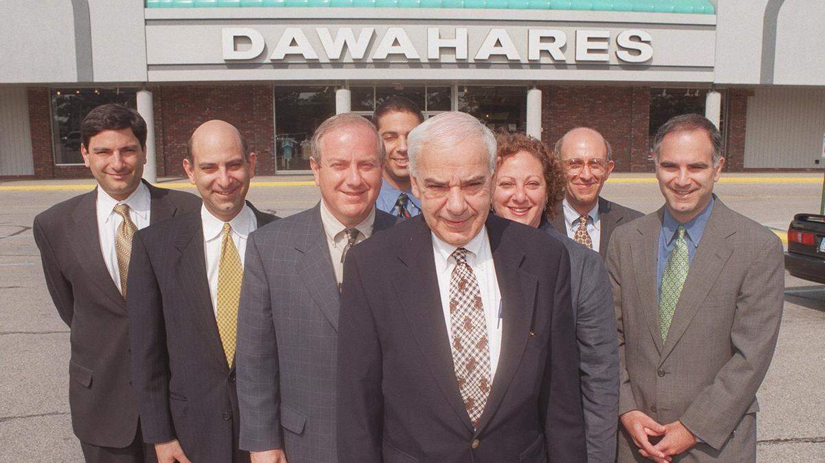 The Dawahare clan, front, President A. F. Dawahare; second row V.P. of Stores Harding Dawahare, Womens’ Buyer Selma Dawahare; third row, Mens’ Merchandising Manager Richard Dawahare, Womens’ Merchandising Manager Jimmy Dawahare, Buyer Mark Dawahare (middle, back), Corporate Counsel Joe Dawahare, and Merchandising Manager Michael Dawahare (far right) were photographed in front of the Dawahares corporate headquarters on Alexandria Drive in Lexington on May 26, 1998.