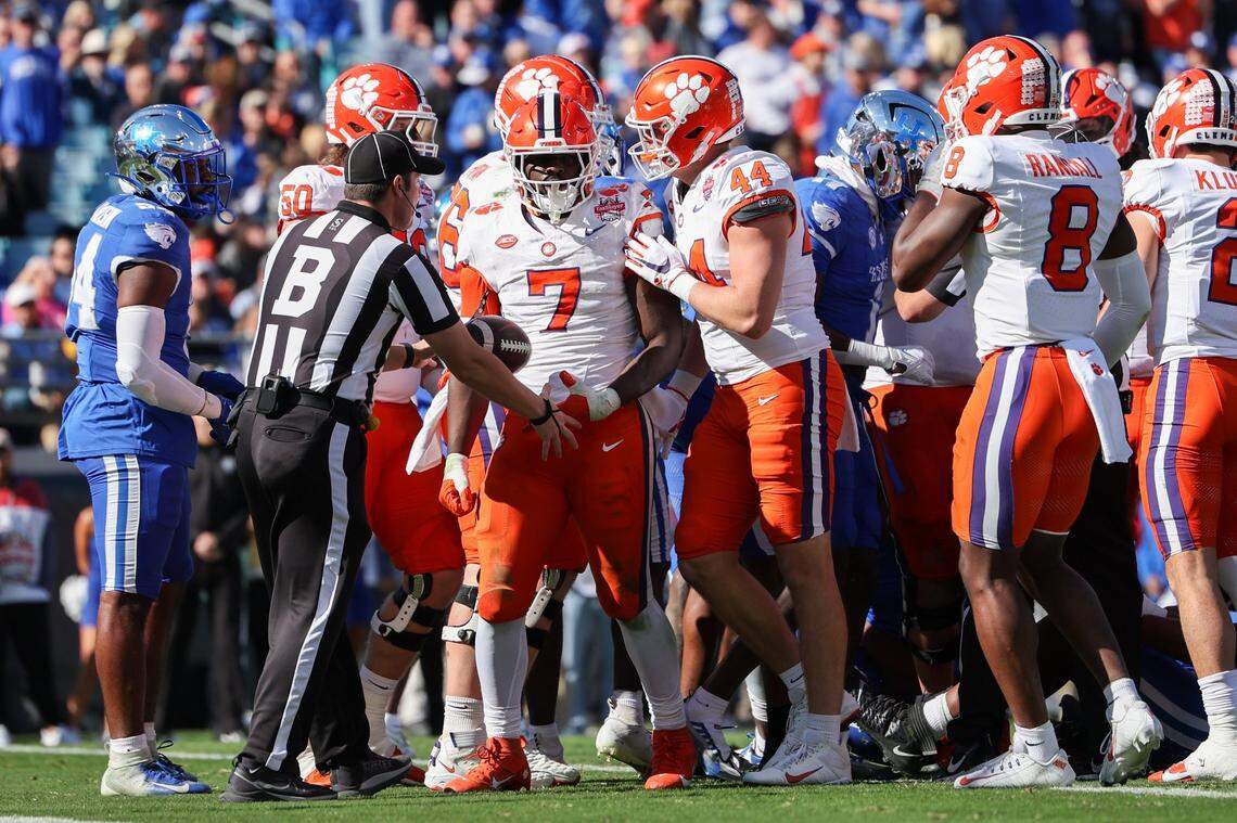 Clemson running back Phil Mafah (7) celebrates a touchdown run against Kentucky in the second quarter of the Gator Bowl at EverBank Stadium in Jacksonville, Florida.