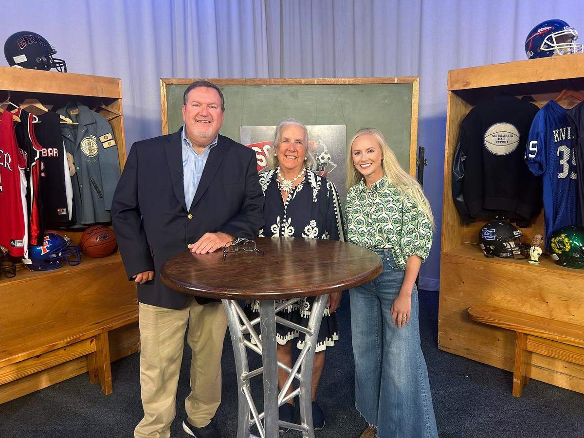 “Scholastic Ball Report” host Gary Ball, left, and executive producer Brigid DeVries take a photo with former "SBR” high school intern Cami Moore Williams, now associate director of athletics communications at the University of Kentucky, at the show’s final taping on Sept. 17. 