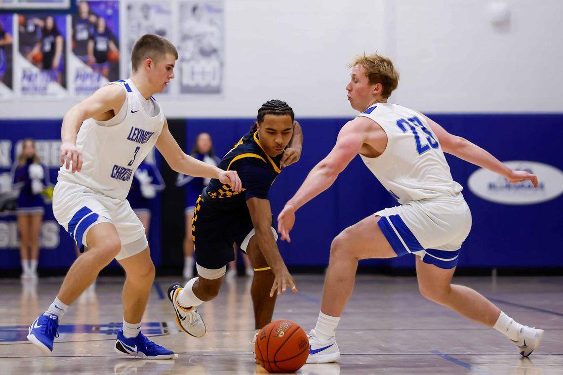 Sayre's Caden Jones (3) dribbles the ball past defenders during a high school boys basketball game, on Saturday, Jan. 17, 2026.