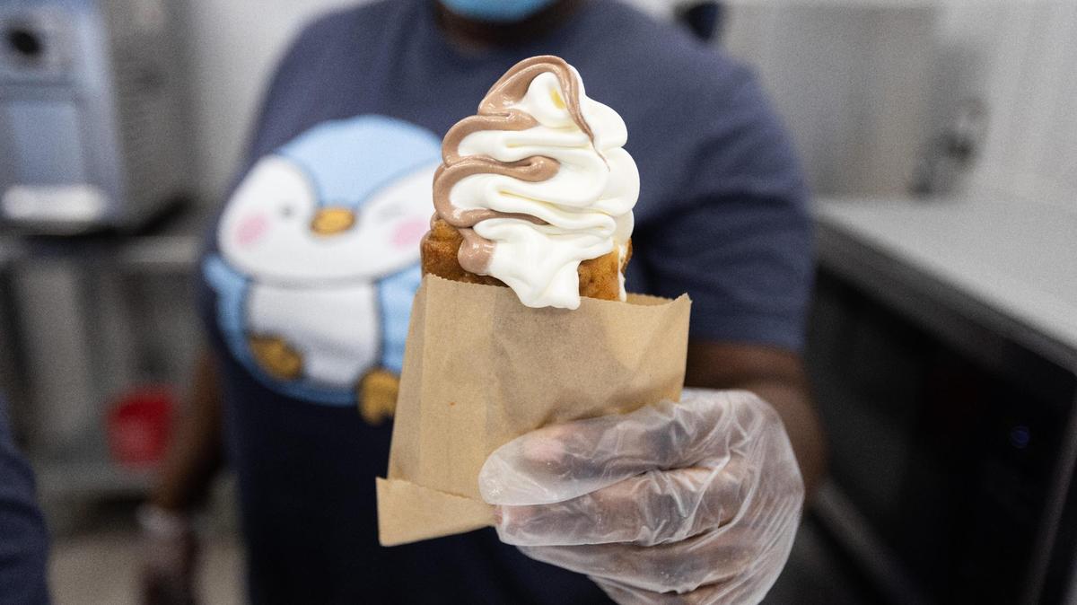 Vanilla and chocolate ice cream swirl served in a taiyaki “fish” waffle cone wrapped in a bag from BoBi Cones soft serve ice cream shop at Palomar Centre Drive. The local ice cream place will close on Aug. 31.