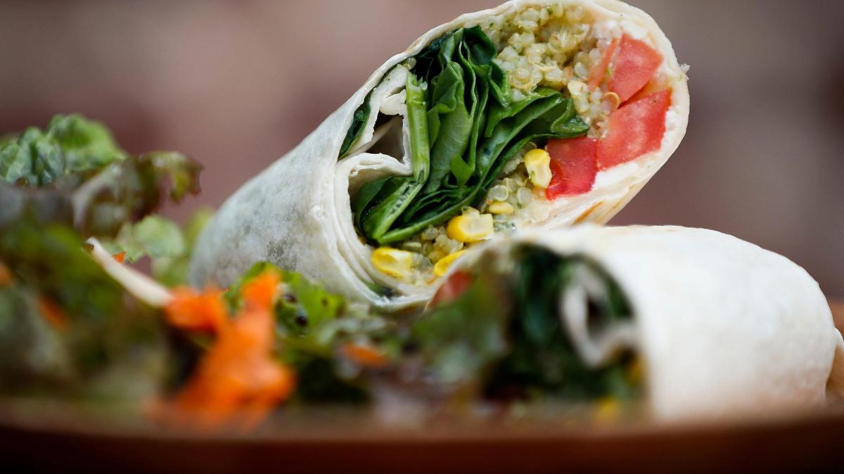 The veggie wrap made with hummus, quinoa salad, tomato, spinach, basil and feta at Broomwagon in Lexington, Ky., Thursday, June 25, 2020. Broomwagon will be shutting down its cafe, but will serve coffee, tea and smoothies through December.