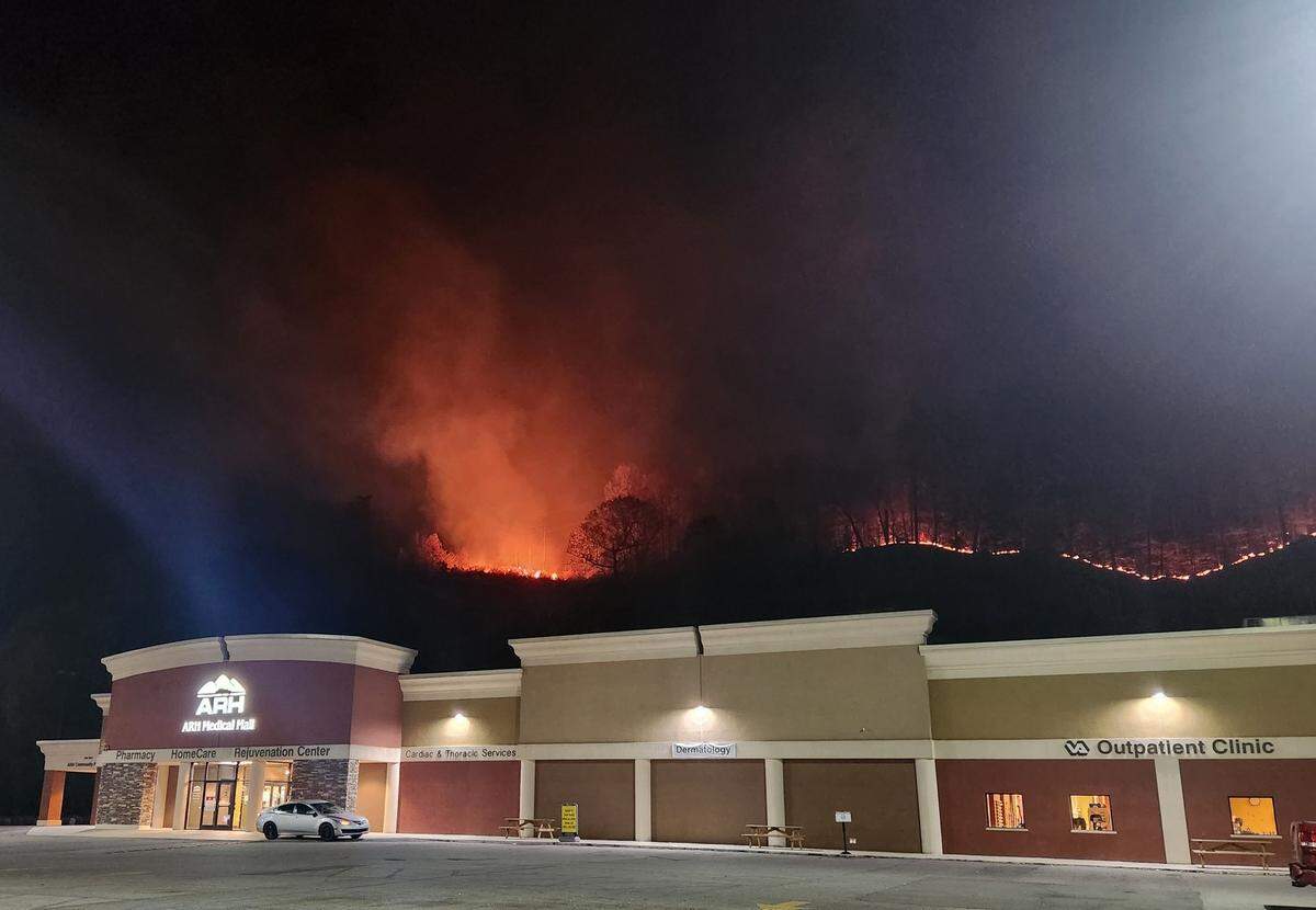 A section of forest behind an ARH Medical Hall in Hazard burns from a wildfire.