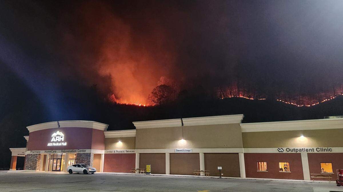 A section of forest behind an ARH Medical Hall in Hazard burns from a wildfire.