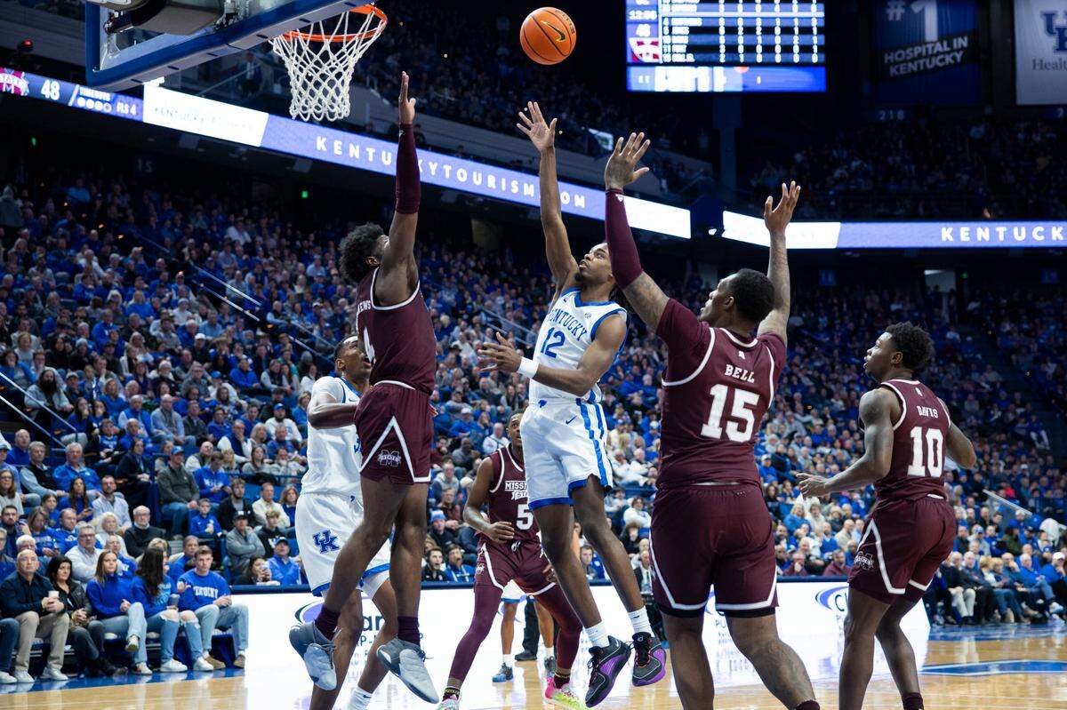 Antonio Reeves puts up a floater between Mississippi State defenders during Kentucky’s victory in Rupp Arena. The Wildcats scored at least 90 points for the ninth time this season, a figure UK hit only three times last season.