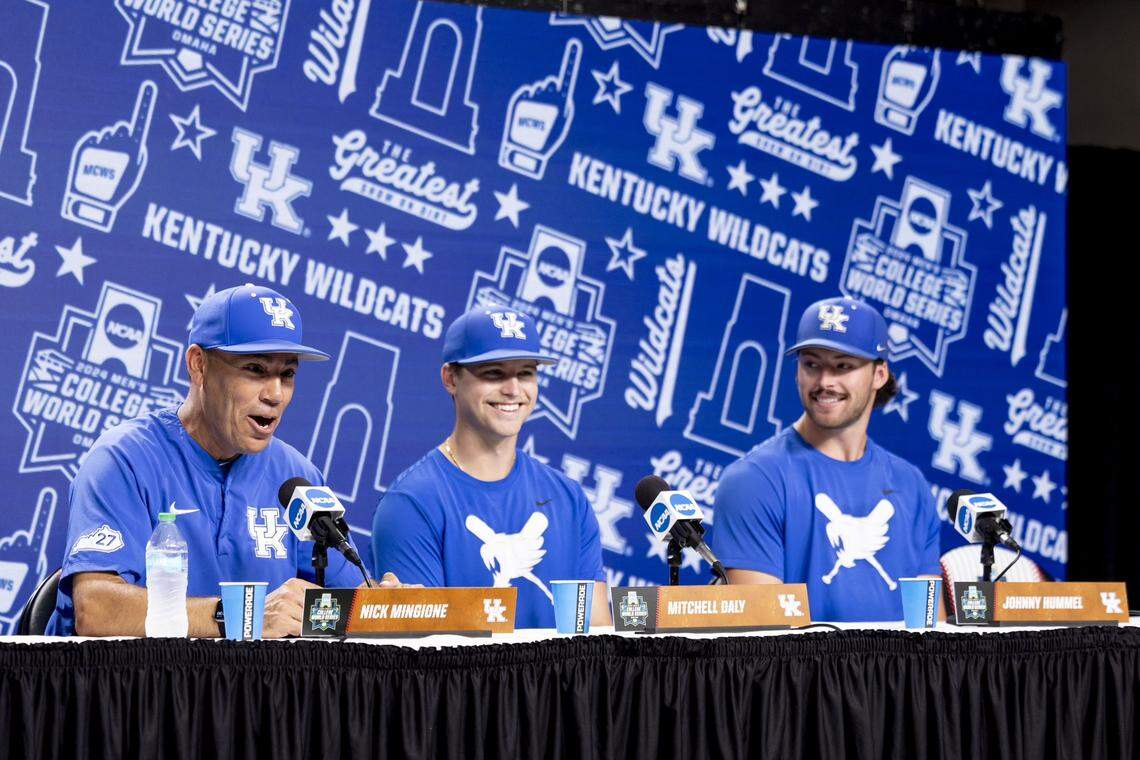 Kentucky coach Nick Mingione, left, and players Mitchell Daly and Johnny Hummel answer questions at a news conference ahead of the College World Series in Omaha, Nebraska.